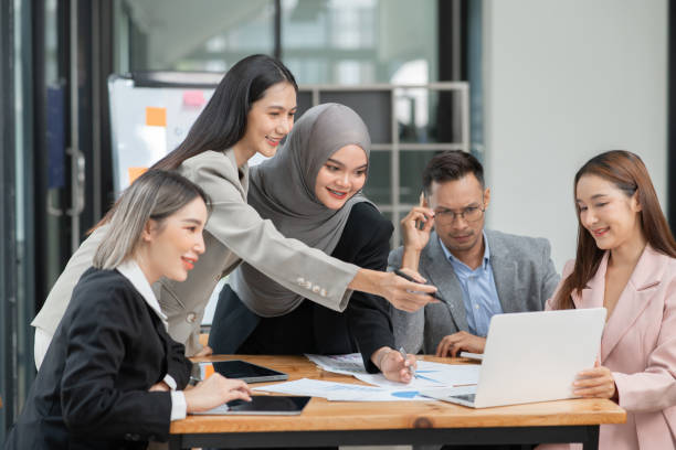 Asian Business Group Chat about graph work Present in meetings, in the office